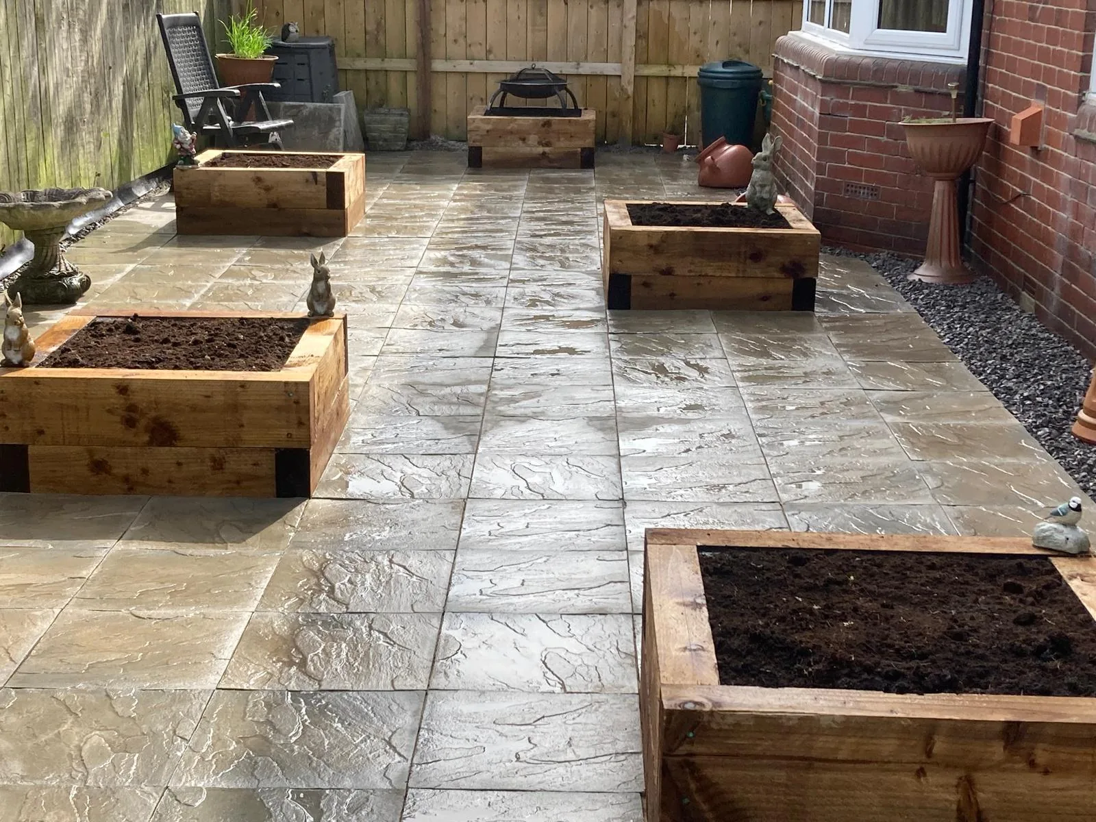 Paved garden with raised timber beds